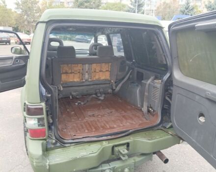 Зелений Міцубісі Паджеро Спорт, об'ємом двигуна 3 л та пробігом 300 тис. км за 2899 $, фото 10 на Automoto.ua