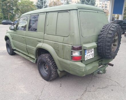 Зелений Міцубісі Паджеро Спорт, об'ємом двигуна 3 л та пробігом 300 тис. км за 2899 $, фото 2 на Automoto.ua