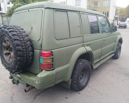 Зелений Міцубісі Паджеро Спорт, об'ємом двигуна 3 л та пробігом 300 тис. км за 2899 $, фото 3 на Automoto.ua