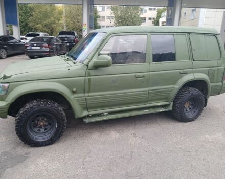 Зелений Міцубісі Паджеро Спорт, об'ємом двигуна 3 л та пробігом 300 тис. км за 2899 $, фото 1 на Automoto.ua