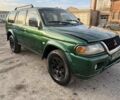 Зелений Міцубісі Паджеро Спорт, об'ємом двигуна 3 л та пробігом 289 тис. км за 2800 $, фото 3 на Automoto.ua