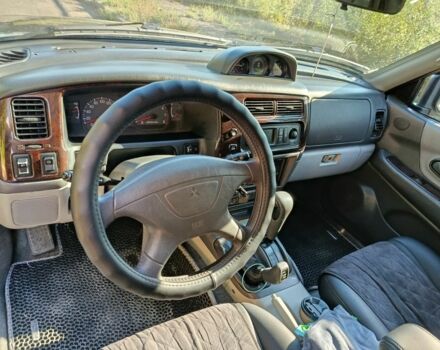 Зелений Міцубісі Паджеро Спорт, об'ємом двигуна 3 л та пробігом 160 тис. км за 8888 $, фото 4 на Automoto.ua