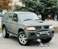 Зеленый Мицубиси Паджеро Спорт, объемом двигателя 2.5 л и пробегом 250 тыс. км за 3850 $, фото 1 на Automoto.ua