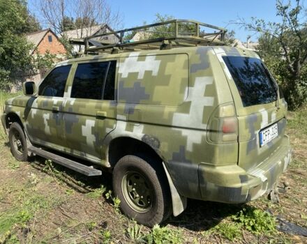 Зелений Міцубісі Паджеро Спорт, об'ємом двигуна 2.5 л та пробігом 280 тис. км за 5809 $, фото 4 на Automoto.ua
