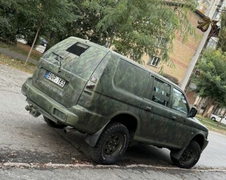 Зеленый Мицубиси Паджеро Спорт, объемом двигателя 2.5 л и пробегом 300 тыс. км за 4999 $, фото 4 на Automoto.ua