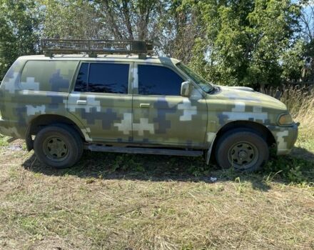 Зелений Міцубісі Паджеро Спорт, об'ємом двигуна 2.5 л та пробігом 280 тис. км за 5809 $, фото 3 на Automoto.ua