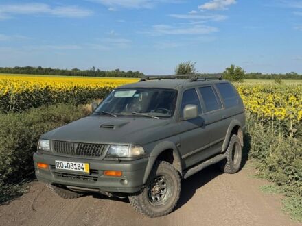 Зелений Міцубісі Паджеро Спорт, об'ємом двигуна 2.5 л та пробігом 150 тис. км за 3800 $, фото 1 на Automoto.ua