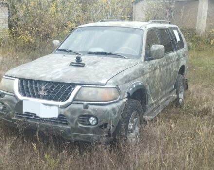 Зелений Міцубісі Паджеро Спорт, об'ємом двигуна 2.5 л та пробігом 395 тис. км за 4800 $, фото 1 на Automoto.ua