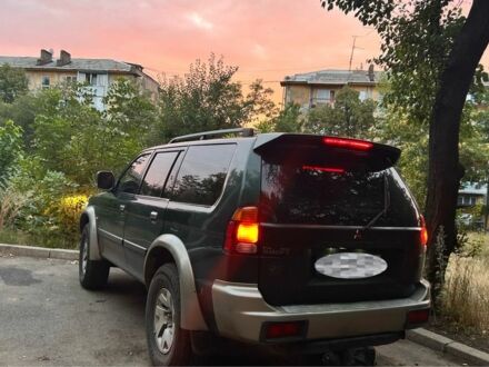 Зеленый Мицубиси Паджеро Спорт, объемом двигателя 2.5 л и пробегом 350 тыс. км за 5400 $, фото 1 на Automoto.ua