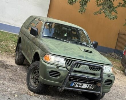 Зеленый Мицубиси Паджеро Спорт, объемом двигателя 2.5 л и пробегом 300 тыс. км за 4999 $, фото 1 на Automoto.ua