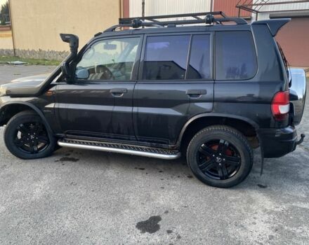 Чорний Міцубісі Паджеро, об'ємом двигуна 1.8 л та пробігом 250 тис. км за 2050 $, фото 4 на Automoto.ua