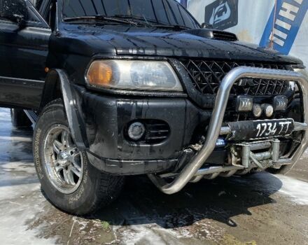 Черный Мицубиси Паджеро, объемом двигателя 2.5 л и пробегом 300 тыс. км за 9000 $, фото 1 на Automoto.ua