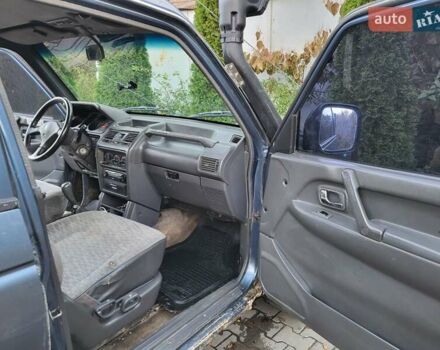Синий Мицубиси Паджеро, объемом двигателя 2.48 л и пробегом 100 тыс. км за 6000 $, фото 8 на Automoto.ua