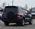 Синій Міцубісі Паджеро, об'ємом двигуна 3 л та пробігом 220 тис. км за 8450 $, фото 1 на Automoto.ua
