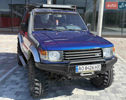 Синий Мицубиси Паджеро, объемом двигателя 3 л и пробегом 230 тыс. км за 10500 $, фото 1 на Automoto.ua
