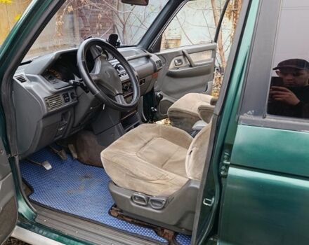 Зеленый Мицубиси Паджеро, объемом двигателя 2.5 л и пробегом 403 тыс. км за 5000 $, фото 3 на Automoto.ua