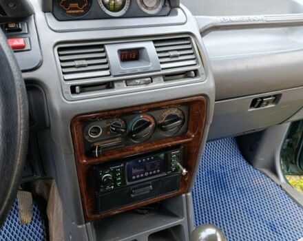 Зеленый Мицубиси Паджеро, объемом двигателя 2.5 л и пробегом 403 тыс. км за 5000 $, фото 4 на Automoto.ua