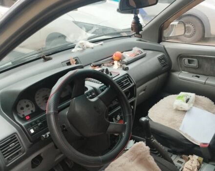 Серый Мицубиси Спейс Раннер, объемом двигателя 2 л и пробегом 56 тыс. км за 1424 $, фото 2 на Automoto.ua