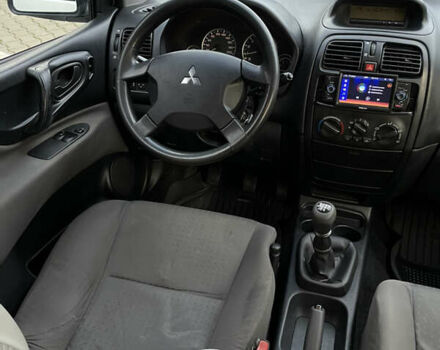 Білий Міцубісі Спейс Стар, об'ємом двигуна 1.58 л та пробігом 319 тис. км за 3500 $, фото 15 на Automoto.ua