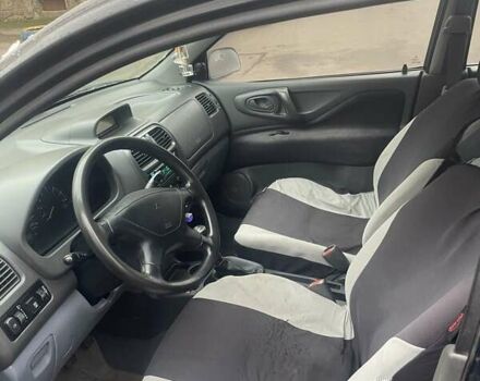 Черный Мицубиси Спейс Стар, объемом двигателя 1.3 л и пробегом 300 тыс. км за 2500 $, фото 4 на Automoto.ua