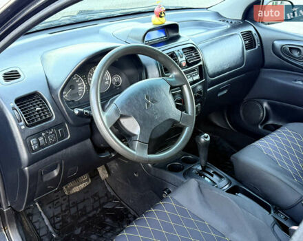 Черный Мицубиси Спейс Стар, объемом двигателя 1.83 л и пробегом 190 тыс. км за 2800 $, фото 10 на Automoto.ua