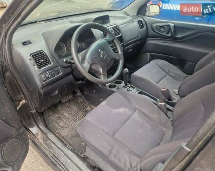 Черный Мицубиси Спейс Стар, объемом двигателя 1.8 л и пробегом 250 тыс. км за 1900 $, фото 1 на Automoto.ua