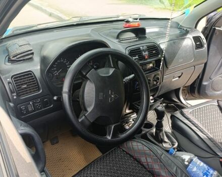 Черный Мицубиси Спейс Стар, объемом двигателя 1.6 л и пробегом 210 тыс. км за 2000 $, фото 2 на Automoto.ua