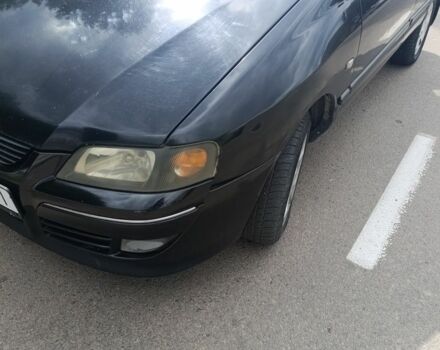 Черный Мицубиси Спейс Стар, объемом двигателя 1.6 л и пробегом 210 тыс. км за 2000 $, фото 1 на Automoto.ua