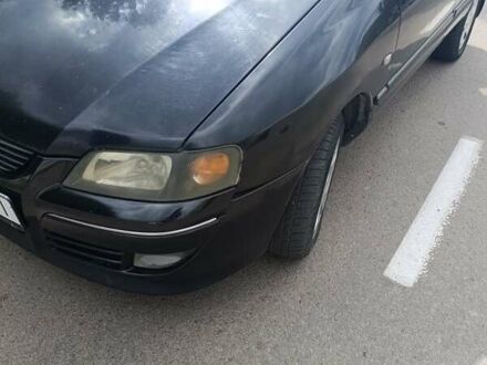 Черный Мицубиси Спейс Стар, объемом двигателя 1.6 л и пробегом 210 тыс. км за 2000 $, фото 1 на Automoto.ua