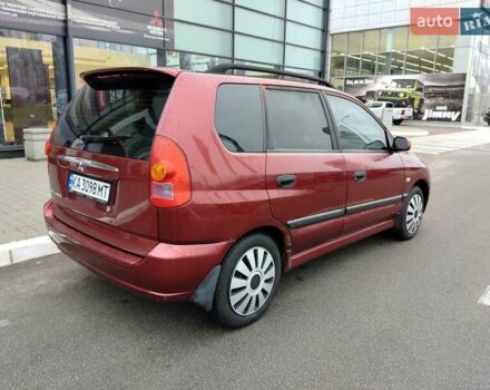 Красный Мицубиси Спейс Стар, объемом двигателя 1.83 л и пробегом 295 тыс. км за 3500 $, фото 2 на Automoto.ua