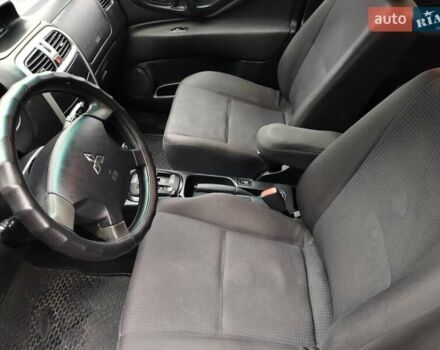 Красный Мицубиси Спейс Стар, объемом двигателя 1.83 л и пробегом 295 тыс. км за 3500 $, фото 9 на Automoto.ua