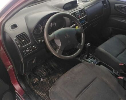 Красный Мицубиси Спейс Стар, объемом двигателя 1.6 л и пробегом 300 тыс. км за 2799 $, фото 1 на Automoto.ua