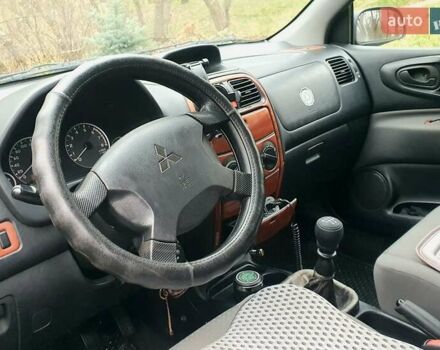 Сірий Міцубісі Спейс Стар, об'ємом двигуна 1.6 л та пробігом 208 тис. км за 3550 $, фото 19 на Automoto.ua