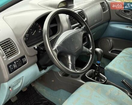 Зеленый Мицубиси Спейс Стар, объемом двигателя 1.3 л и пробегом 203 тыс. км за 3000 $, фото 7 на Automoto.ua