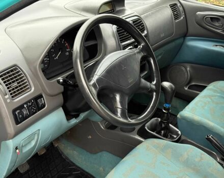 Зеленый Мицубиси Спейс Стар, объемом двигателя 1.3 л и пробегом 205 тыс. км за 3000 $, фото 7 на Automoto.ua