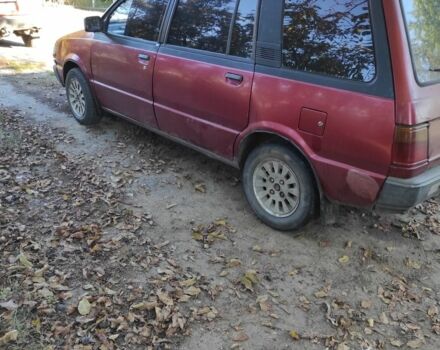 Красный Мицубиси Спейс Вагон, объемом двигателя 1.8 л и пробегом 325 тыс. км за 1150 $, фото 1 на Automoto.ua