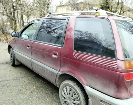 Красный Мицубиси Спейс Вагон, объемом двигателя 2 л и пробегом 300 тыс. км за 2011 $, фото 1 на Automoto.ua