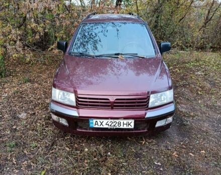 Красный Мицубиси Спейс Вагон, объемом двигателя 2.4 л и пробегом 200 тыс. км за 2944 $, фото 1 на Automoto.ua