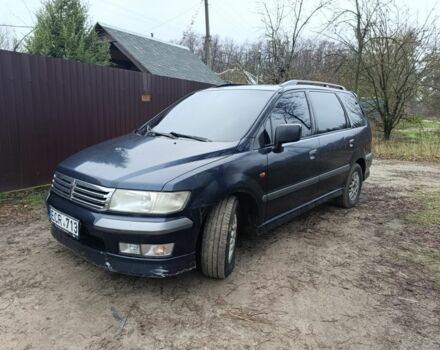 Синий Мицубиси Спейс Вагон, объемом двигателя 2.4 л и пробегом 333 тыс. км за 1000 $, фото 1 на Automoto.ua