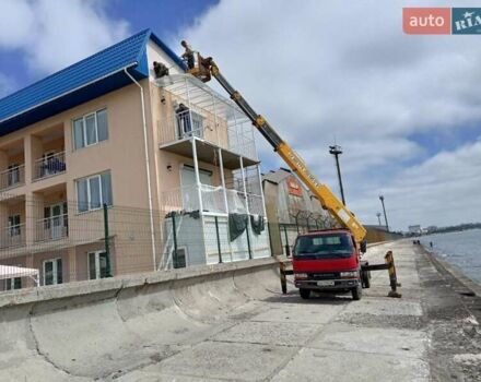 Красный Мицубиси Fuso Canter, объемом двигателя 4 л и пробегом 170 тыс. км за 40000 $, фото 3 на Automoto.ua
