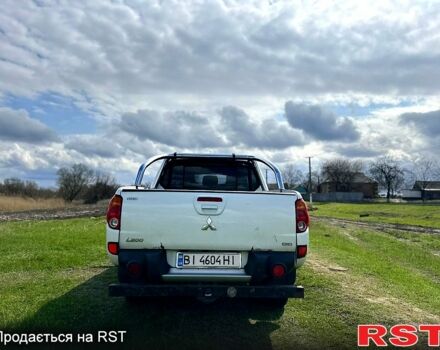 Белый Мицубиси L200, объемом двигателя 2.5 л и пробегом 230 тыс. км за 15600 $, фото 5 на Automoto.ua