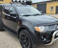 Черный Мицубиси L200, объемом двигателя 2.5 л и пробегом 260 тыс. км за 2700 $, фото 1 на Automoto.ua