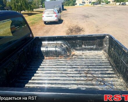 Черный Мицубиси L200, объемом двигателя 2.5 л и пробегом 142 тыс. км за 3700 $, фото 4 на Automoto.ua