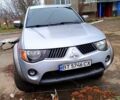 Серый Мицубиси L200, объемом двигателя 2.5 л и пробегом 160 тыс. км за 13500 $, фото 1 на Automoto.ua