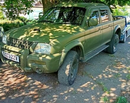 Зеленый Мицубиси L200, объемом двигателя 2.5 л и пробегом 83 тыс. км за 4300 $, фото 1 на Automoto.ua
