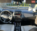 Белый Мицубиси Outlander Sport, объемом двигателя 2 л и пробегом 170 тыс. км за 11000 $, фото 5 на Automoto.ua