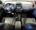 Белый Мицубиси Outlander Sport, объемом двигателя 2.4 л и пробегом 186 тыс. км за 1600 $, фото 6 на Automoto.ua