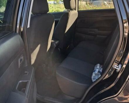 Черный Мицубиси Outlander Sport, объемом двигателя 1.97 л и пробегом 80 тыс. км за 12000 $, фото 1 на Automoto.ua