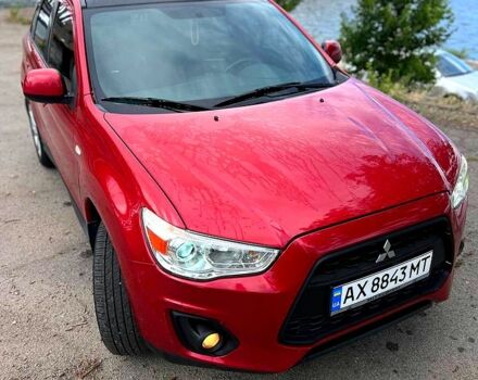Красный Мицубиси Outlander Sport, объемом двигателя 2 л и пробегом 174 тыс. км за 10700 $, фото 6 на Automoto.ua