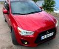 Красный Мицубиси Outlander Sport, объемом двигателя 2 л и пробегом 174 тыс. км за 10700 $, фото 6 на Automoto.ua